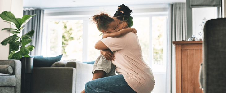 mother hugging child in a living room acs cases