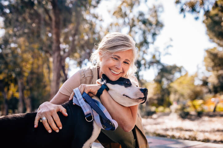 Woman holding her dog