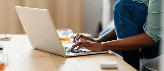 woman typing on a laptop on a desk order of protection